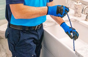 Z PLUMBERS servicing tub drain