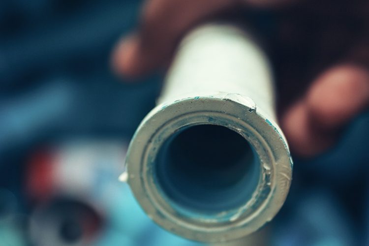 Close up of a plumbing pipe that has been relined with epoxy.