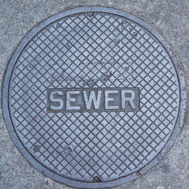 Sewer Lid Stock Photo for Sewer Plumbing Services