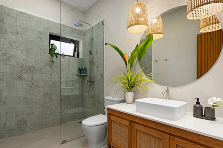 Photo of modern bathroom with high-efficiency water fixtures.