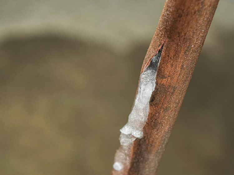 Closeup of pipe that froze and burst.
