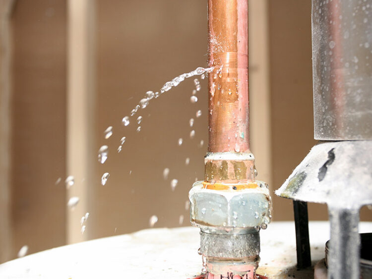 Busted water heater pipe leaking water.