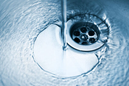 Water running into kitchen sink.