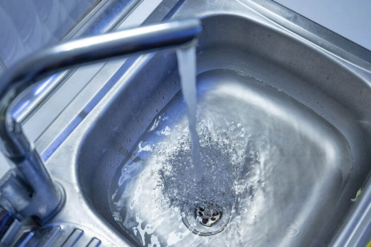 Kitchen sink running but not draining.