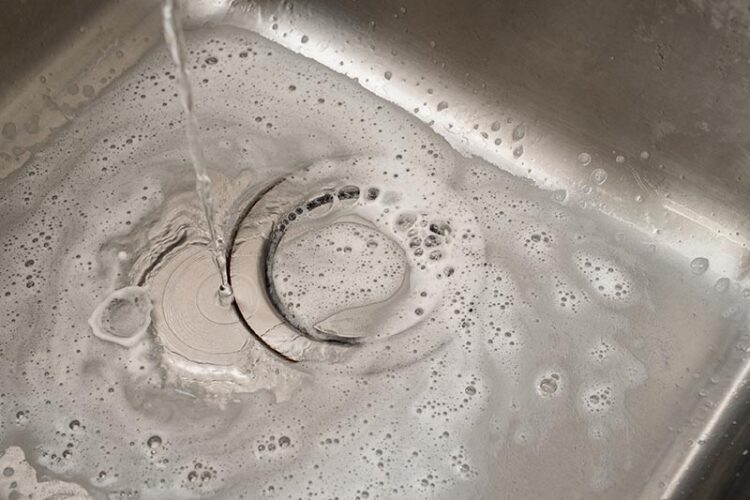 Soapy water backed up in a kitchen sink
