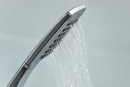 Showerhead with water weakly streaming from it.