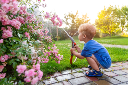 Kid playing with hose