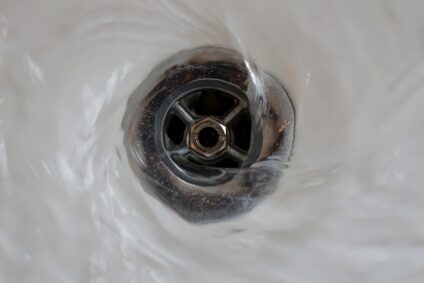 Water going down a sink drain.