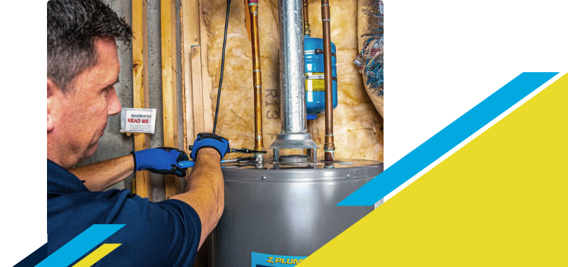 Z PLUMBERZ of Ann Arbor technician fixing water heater