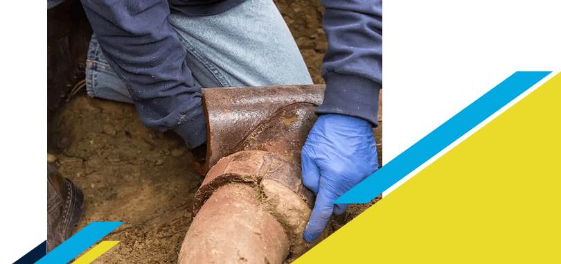 Z PLUMBERZ of Central Long Island worker inspecting a sewer pipe