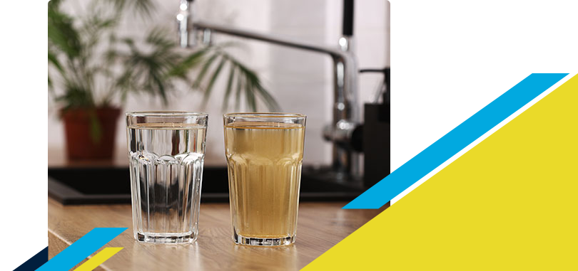 Two glasses full of water with one being clean and other dirty